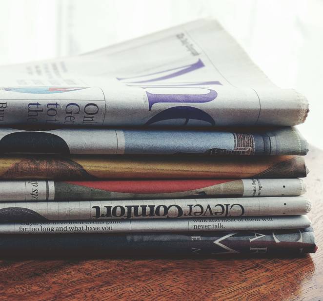 Stack of folded newspapers